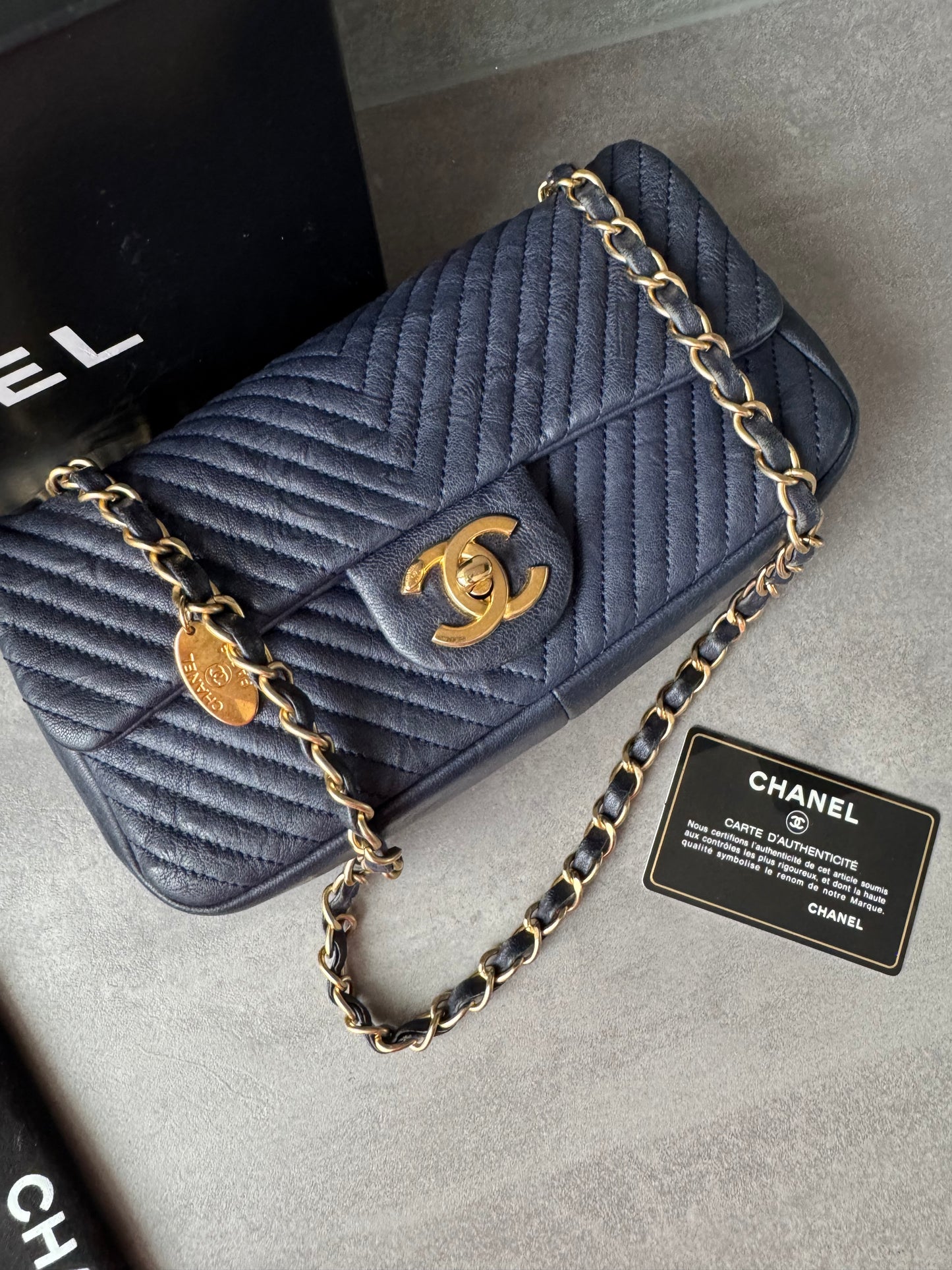 CHANEL Small Chevron Quilted Flap Bag in Navy Distressed Lambskin