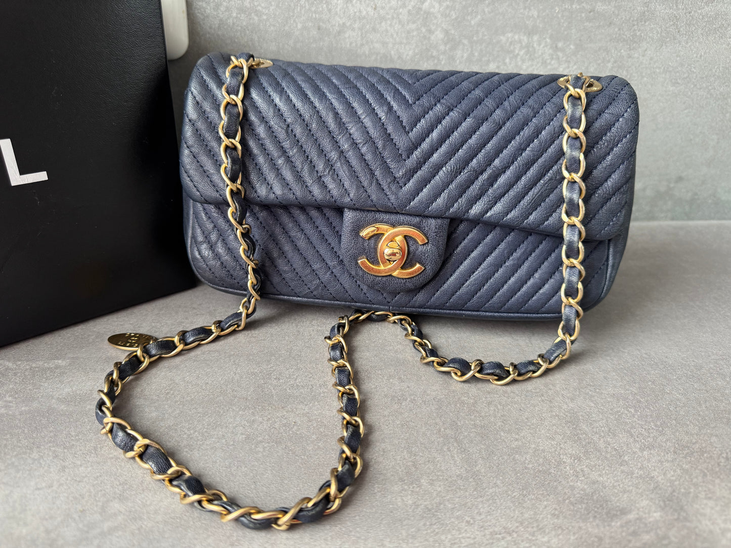 CHANEL Small Chevron Quilted Flap Bag in Navy Distressed Lambskin