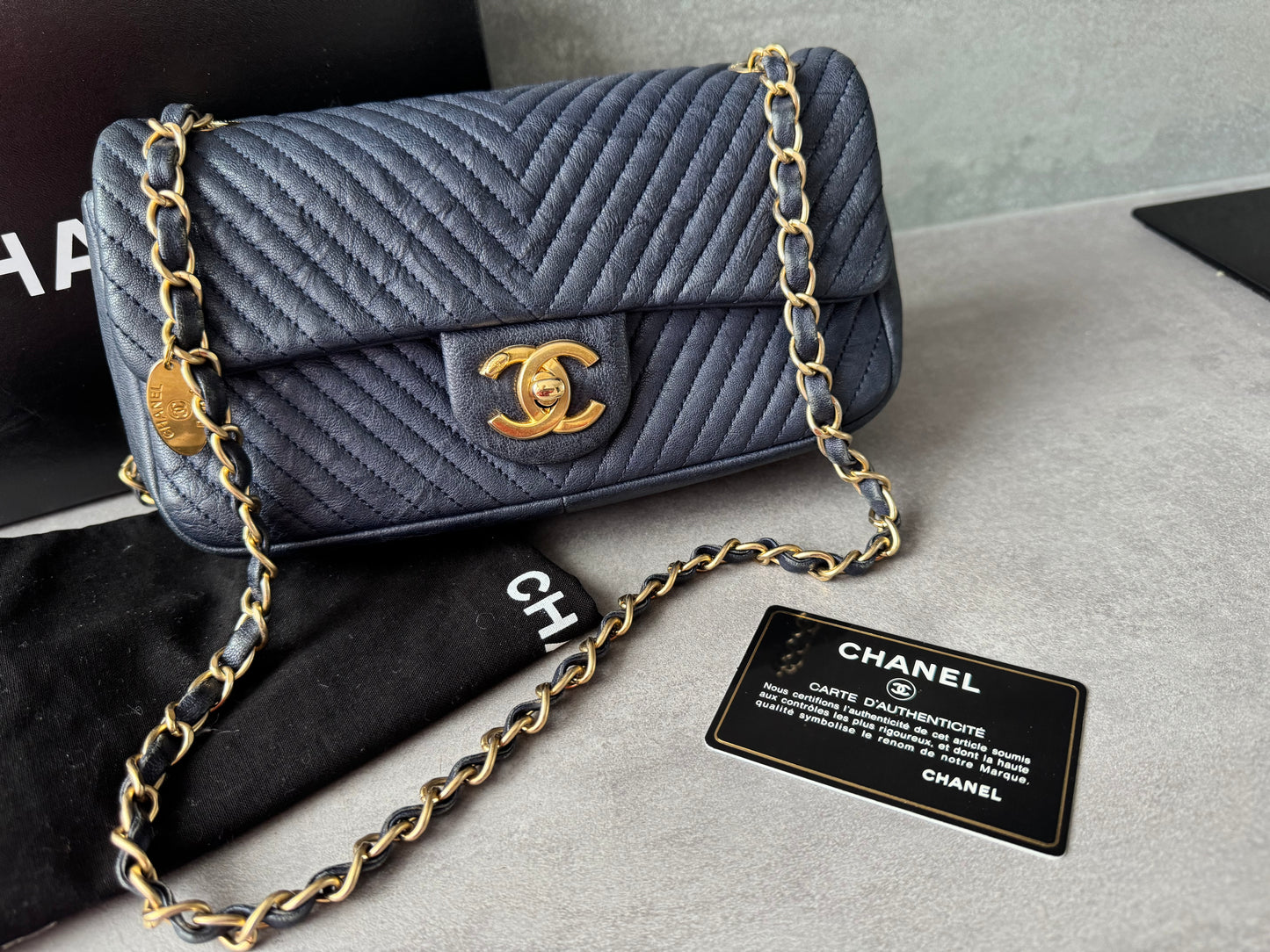 CHANEL Small Chevron Quilted Flap Bag in Navy Distressed Lambskin