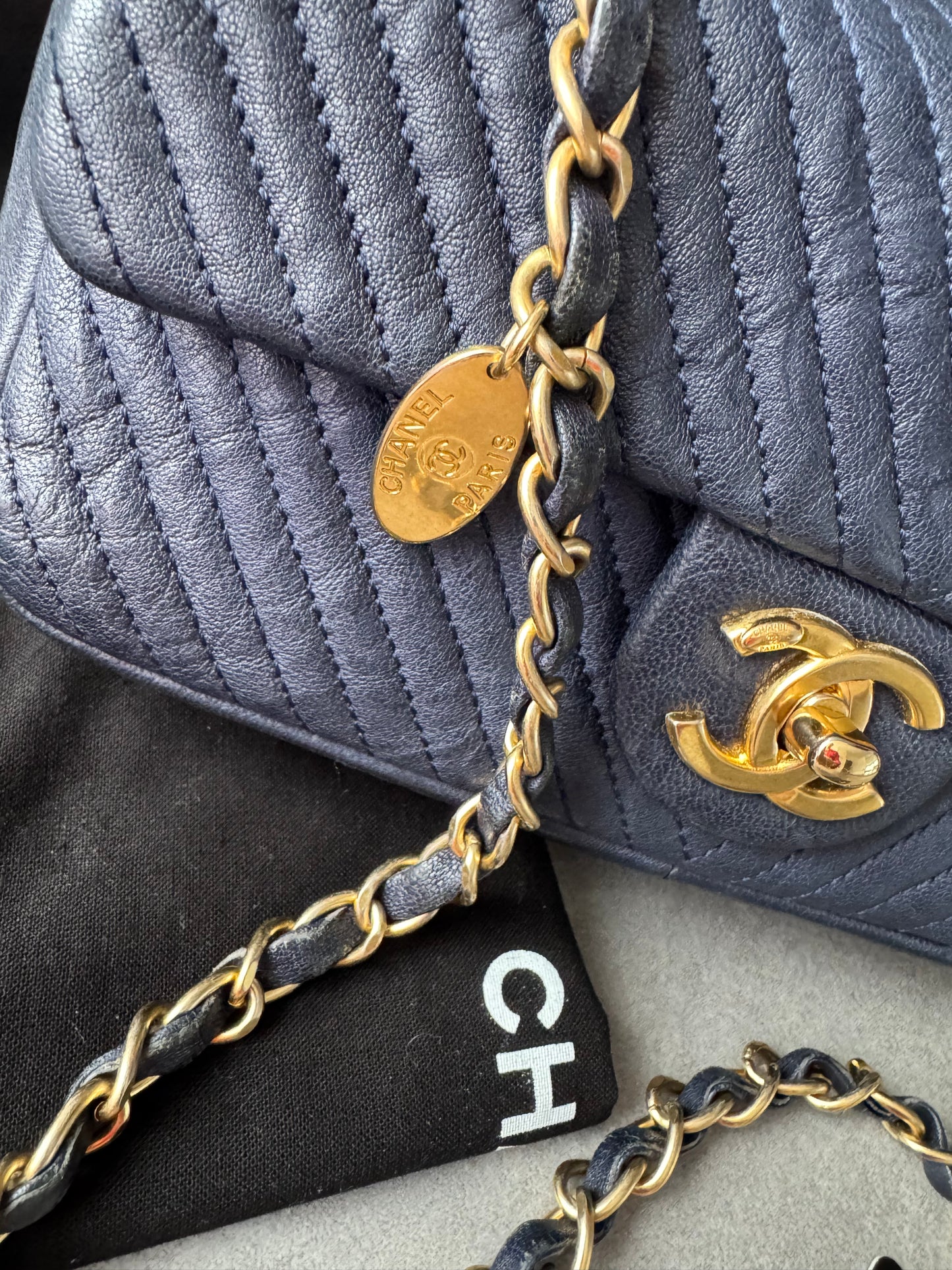 CHANEL Small Chevron Quilted Flap Bag in Navy Distressed Lambskin